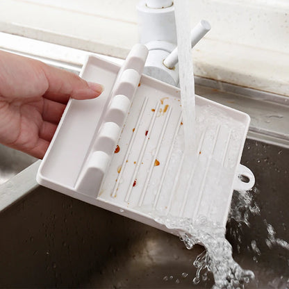CleanCook™ – A holder that keeps your countertop clean while you cook